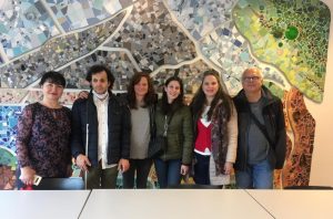 A group of participants in front of a wall