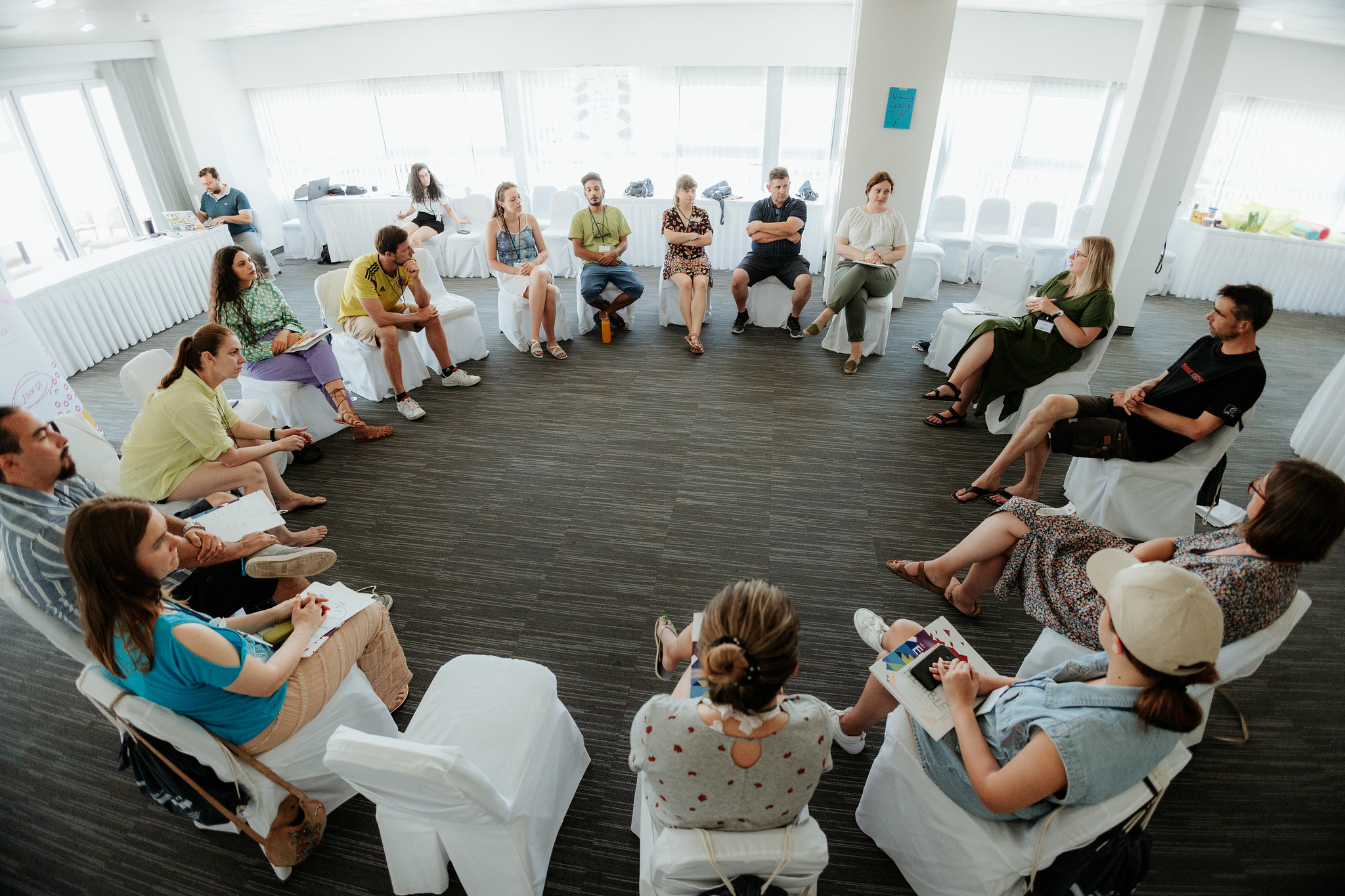 People are sitting in a circle