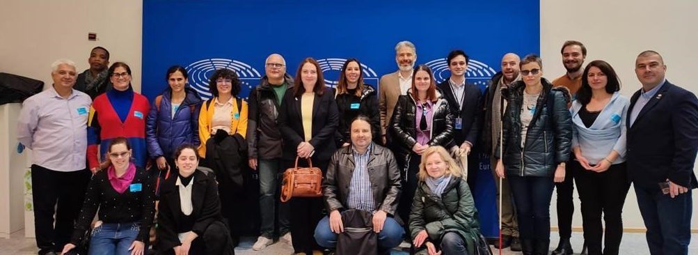 All the people who helped with the implementation of the project are posing inside the European Parliament. In total, there are 20 persons.