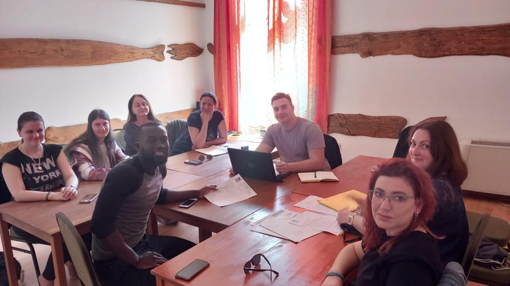 Participants sit at a table during the work session