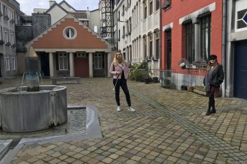 Patricia and Kinga pose together in a sunny courtyard