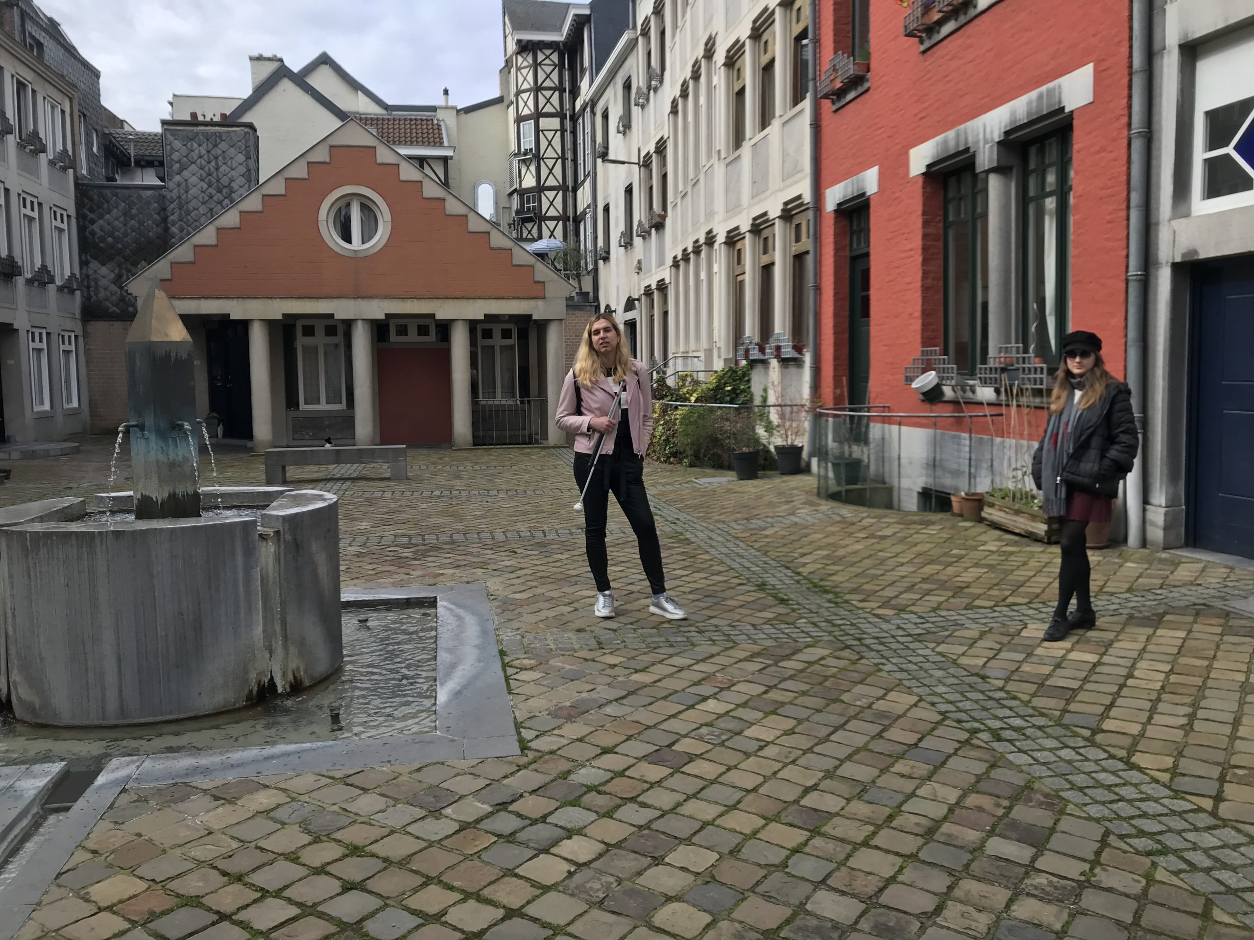 Patricia and Kinga pose together in a sunny courtyard