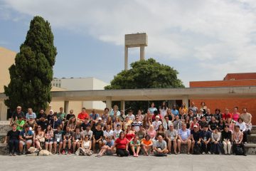 ICC participqnts posing for a group picture in front of the venue.
