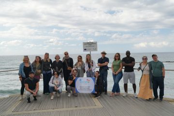 photo group, on the background the sea