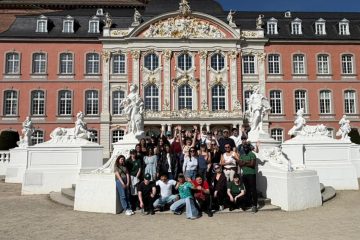 Participants' group posing in front of a nice building in Trier