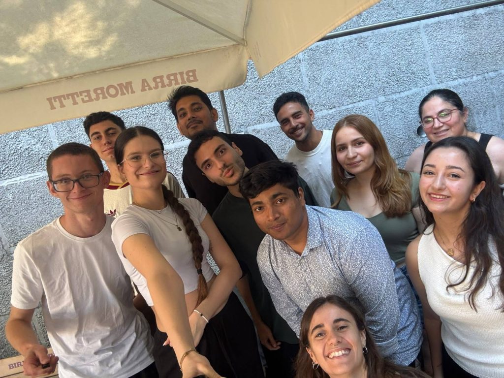 Participants from different countries gather for a group selfie during the Erasmus+ Youth Seminar, smiling together during an informal networking moment between activities.